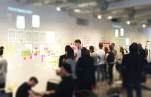 A group reviewing notes during a process-mapping workshop