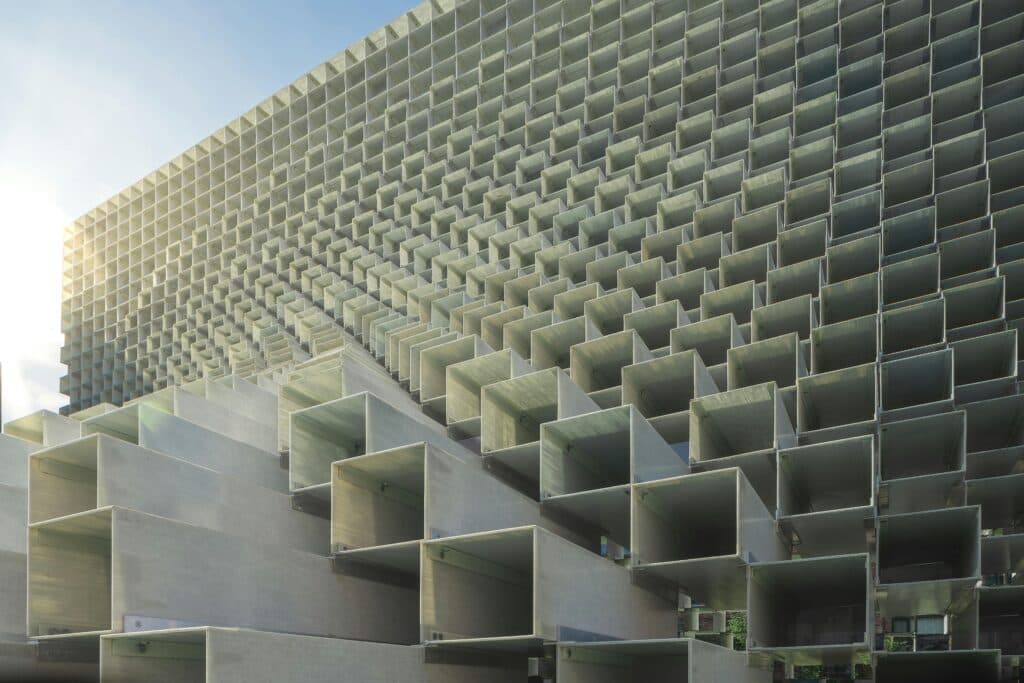 A geometric building facade made from repeating openings
